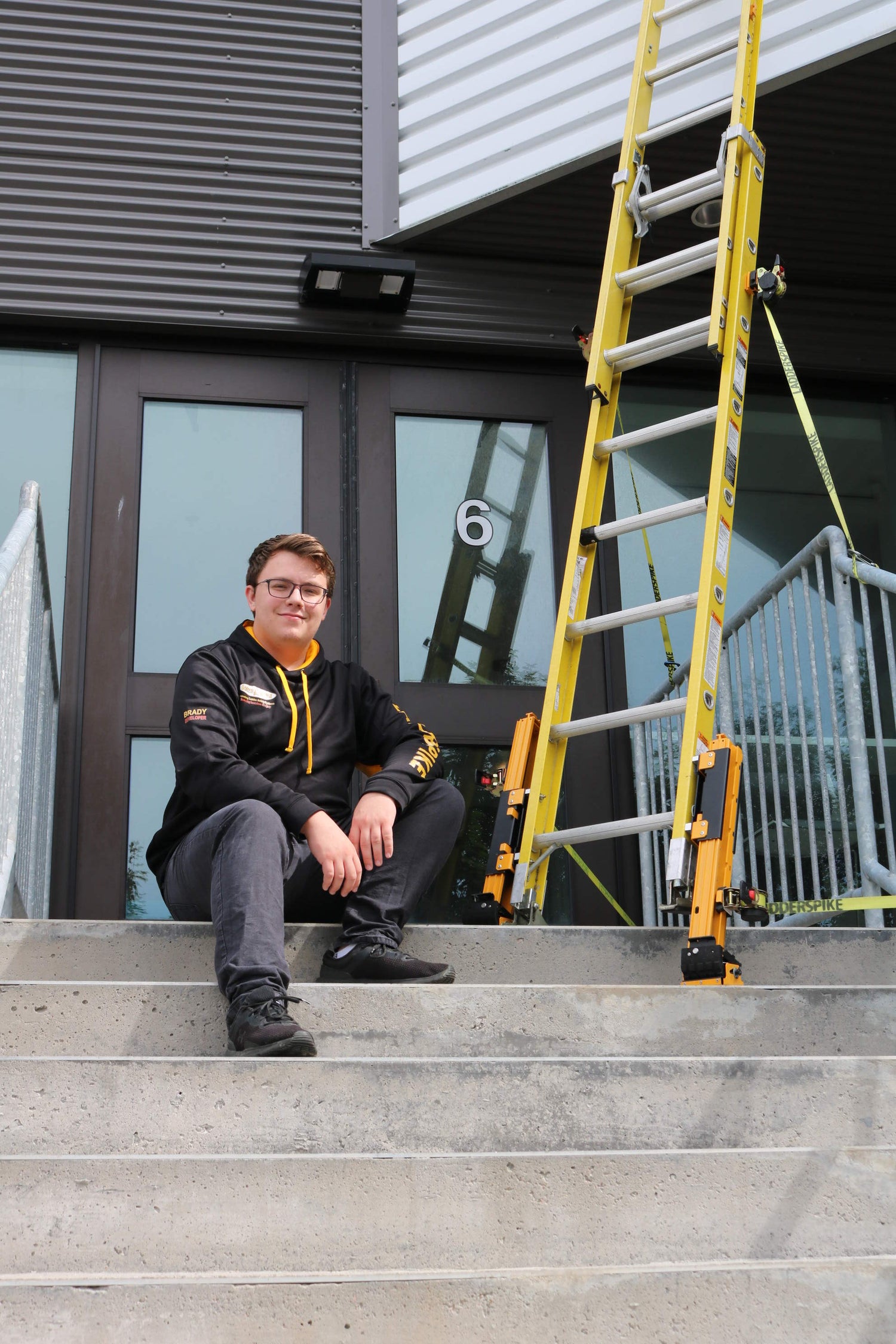 Brady Smith sitting next to the ladder evolution pro